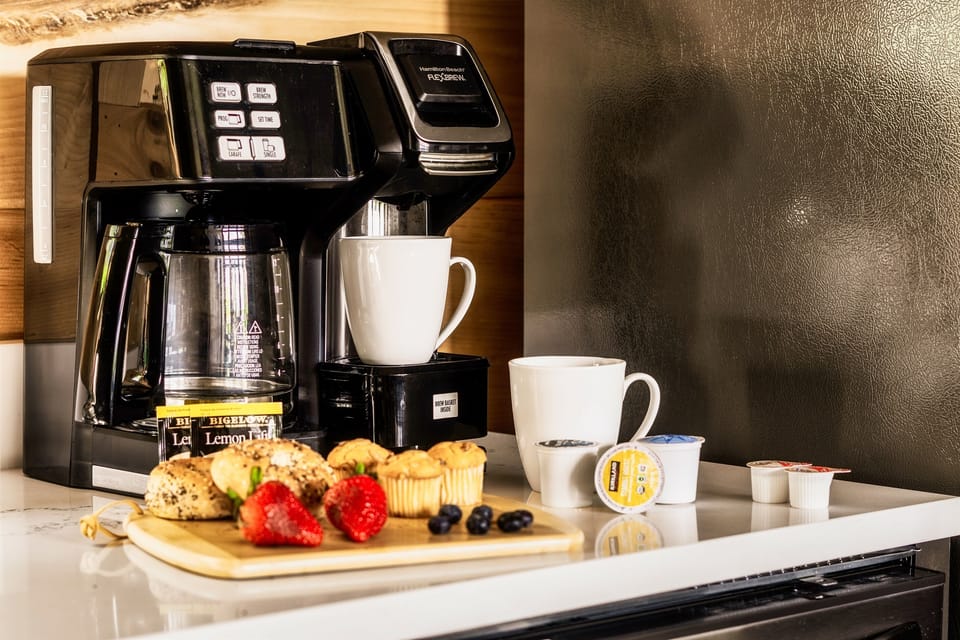 Start your day right at our coffee corner! A Keurig brewer awaits, stocked with a variety of K-Cups, coffee powder, creamer, and sugar packets. Your perfect cup, just the way you like it. ☕