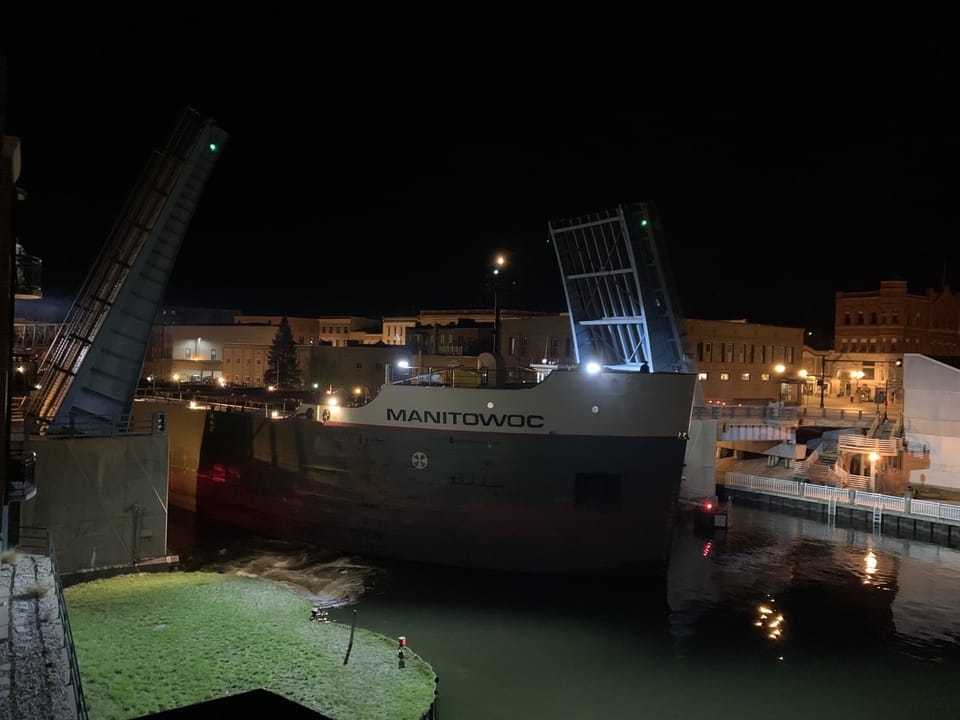Ship going through the drawbridge captured with a camera from the balcony of this condo.