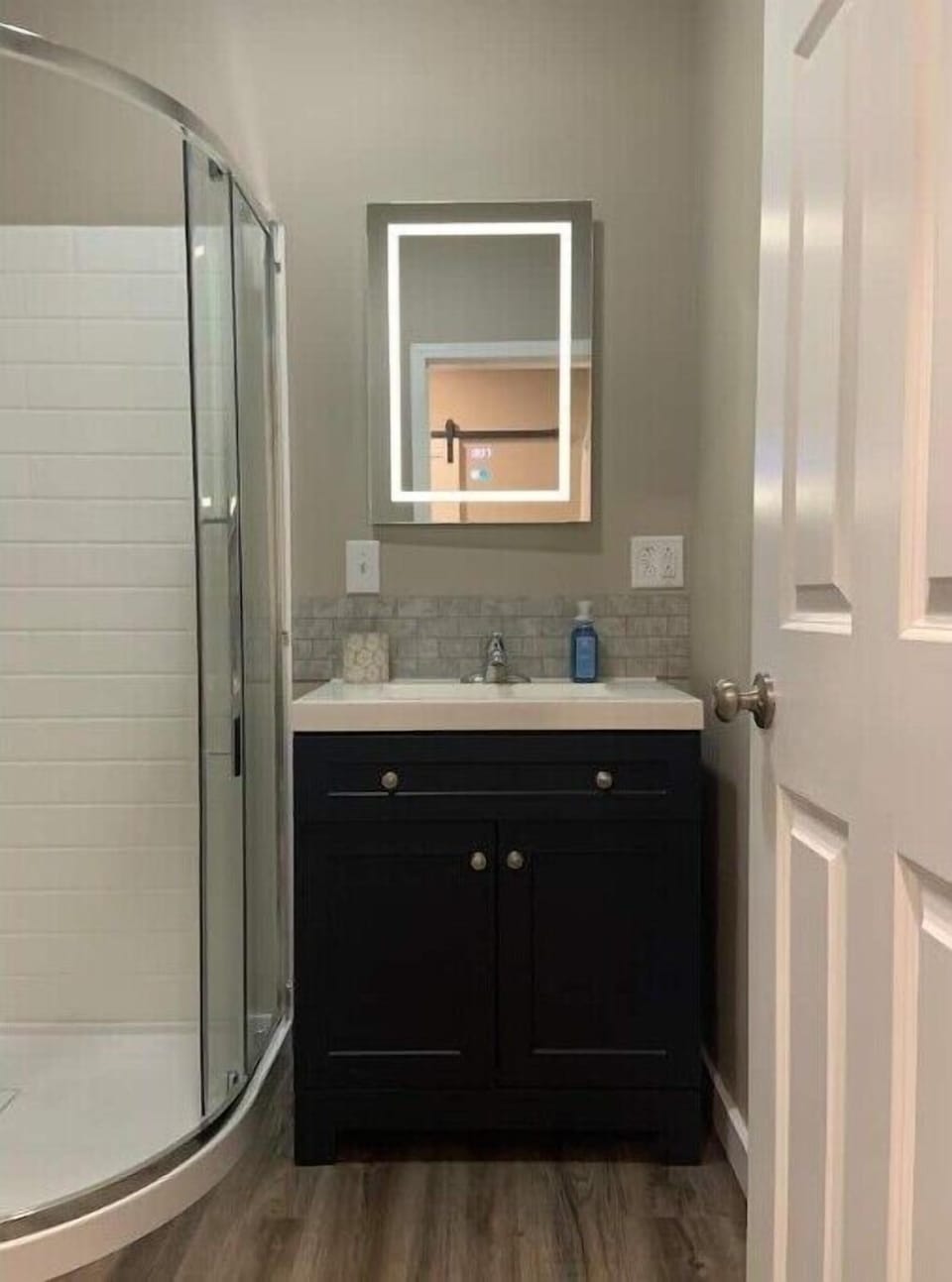 Full bath with 30" vanity.  LED mirror has a clock and defogger.