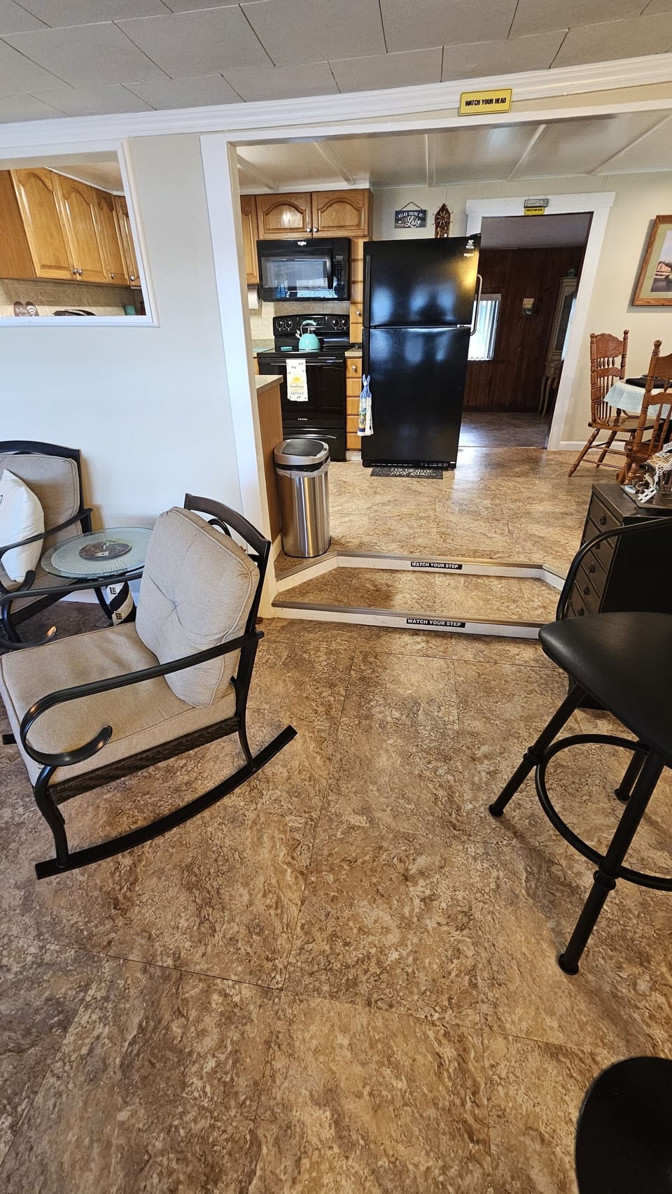 Florida room facing kitchen to left, livingroom straight ahead