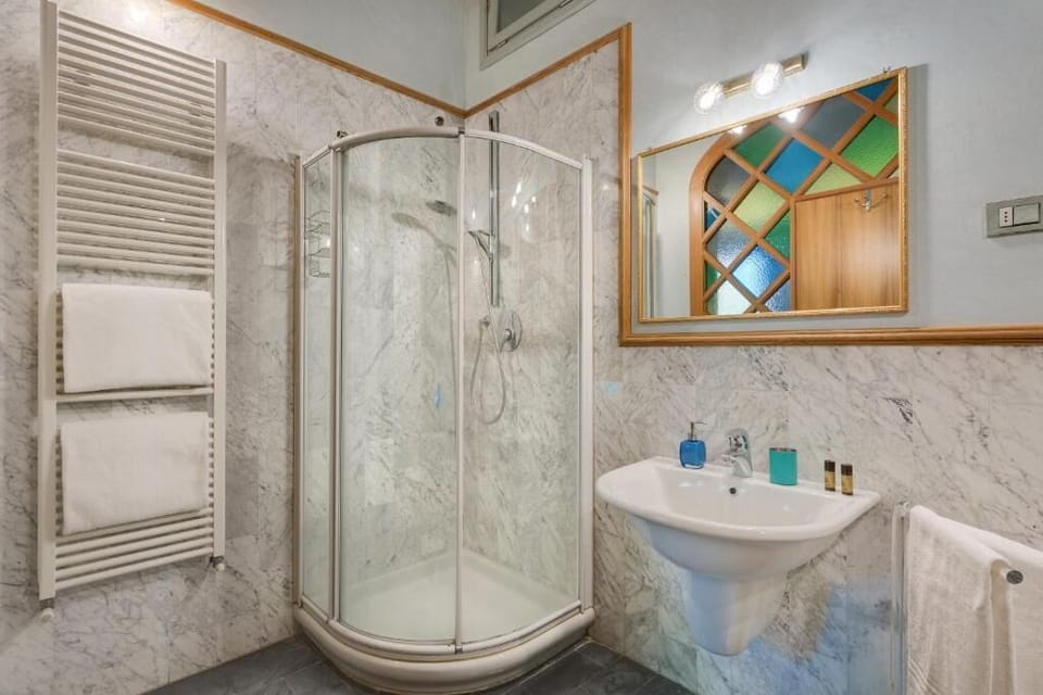 Shower, designer toiletries, hair dryer, bidet