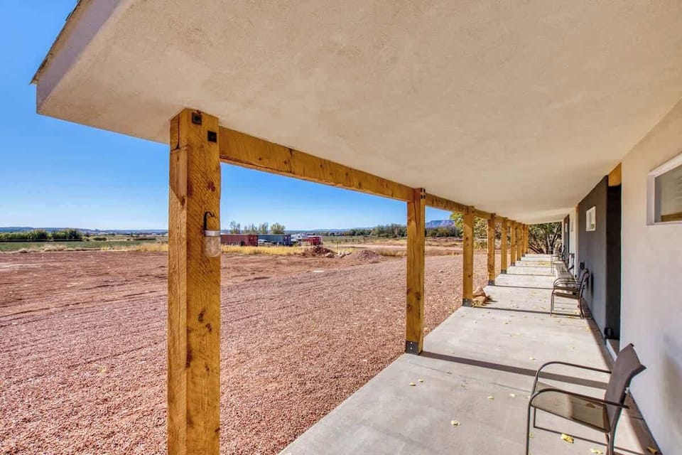 The covered back porch is perfect for catching the sunset or enjoying the stars.