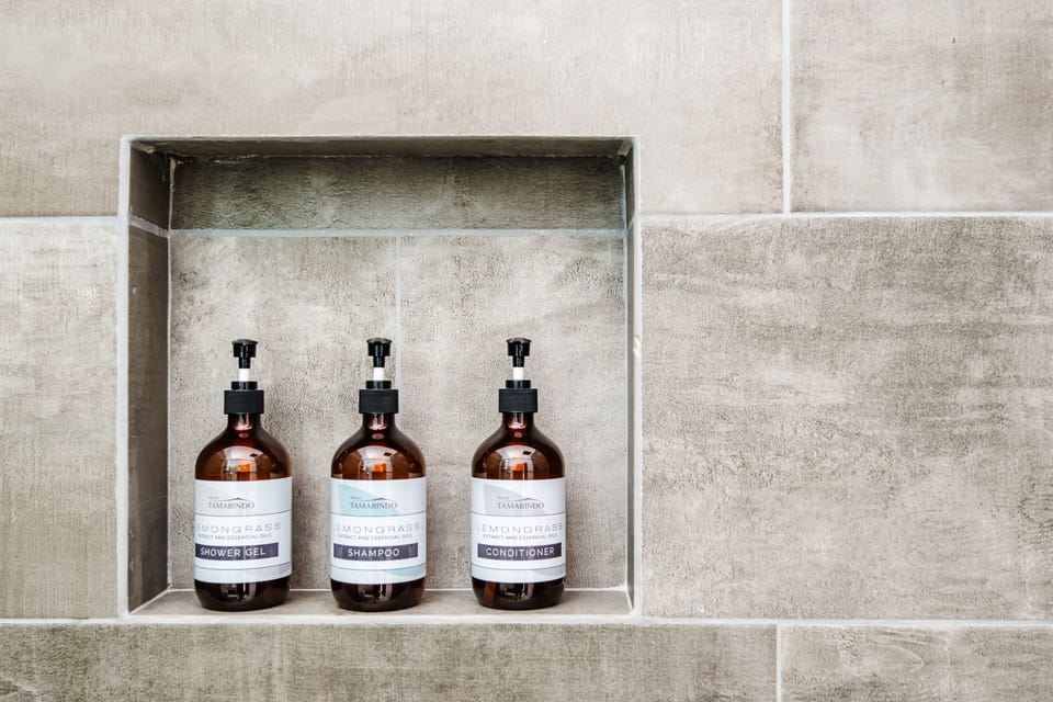 Elevate your stay with complimentary shower essentials: gel, shampoo, and conditioner included