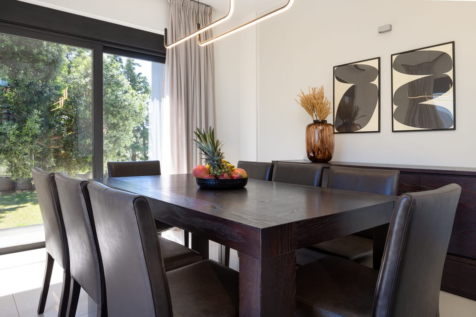 The dining area offers views and exit to the garden.