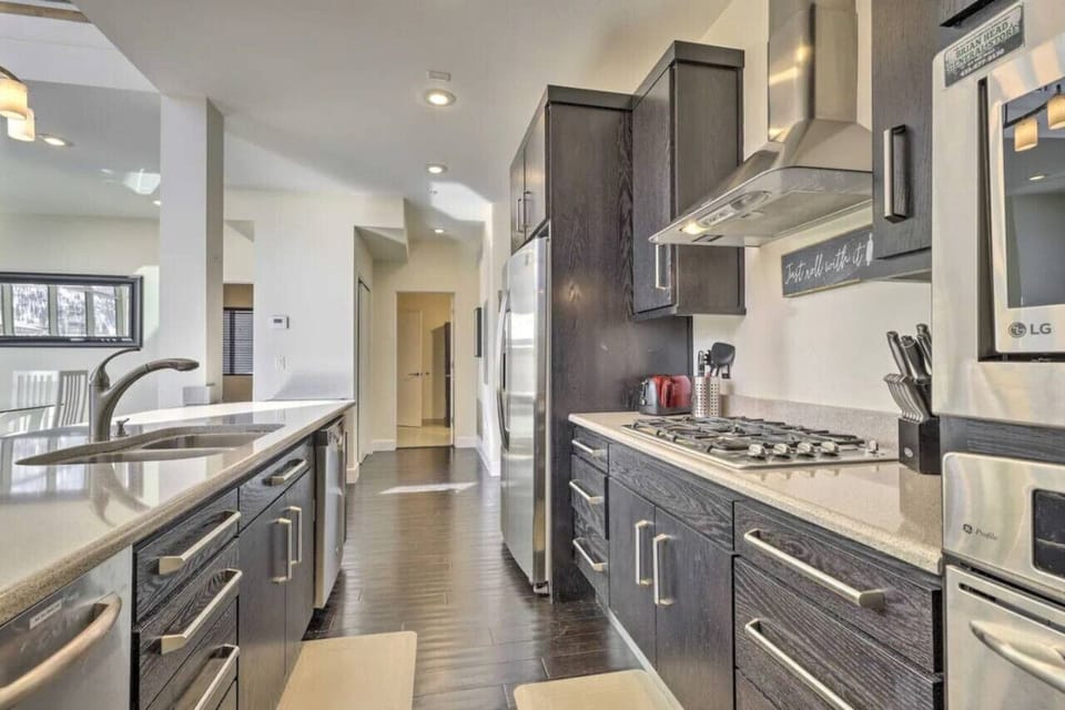 The fully equipped kitchen comes with all the cooking essentials, a breakfast bar, drip coffee maker, toaster, blender, and dishware.