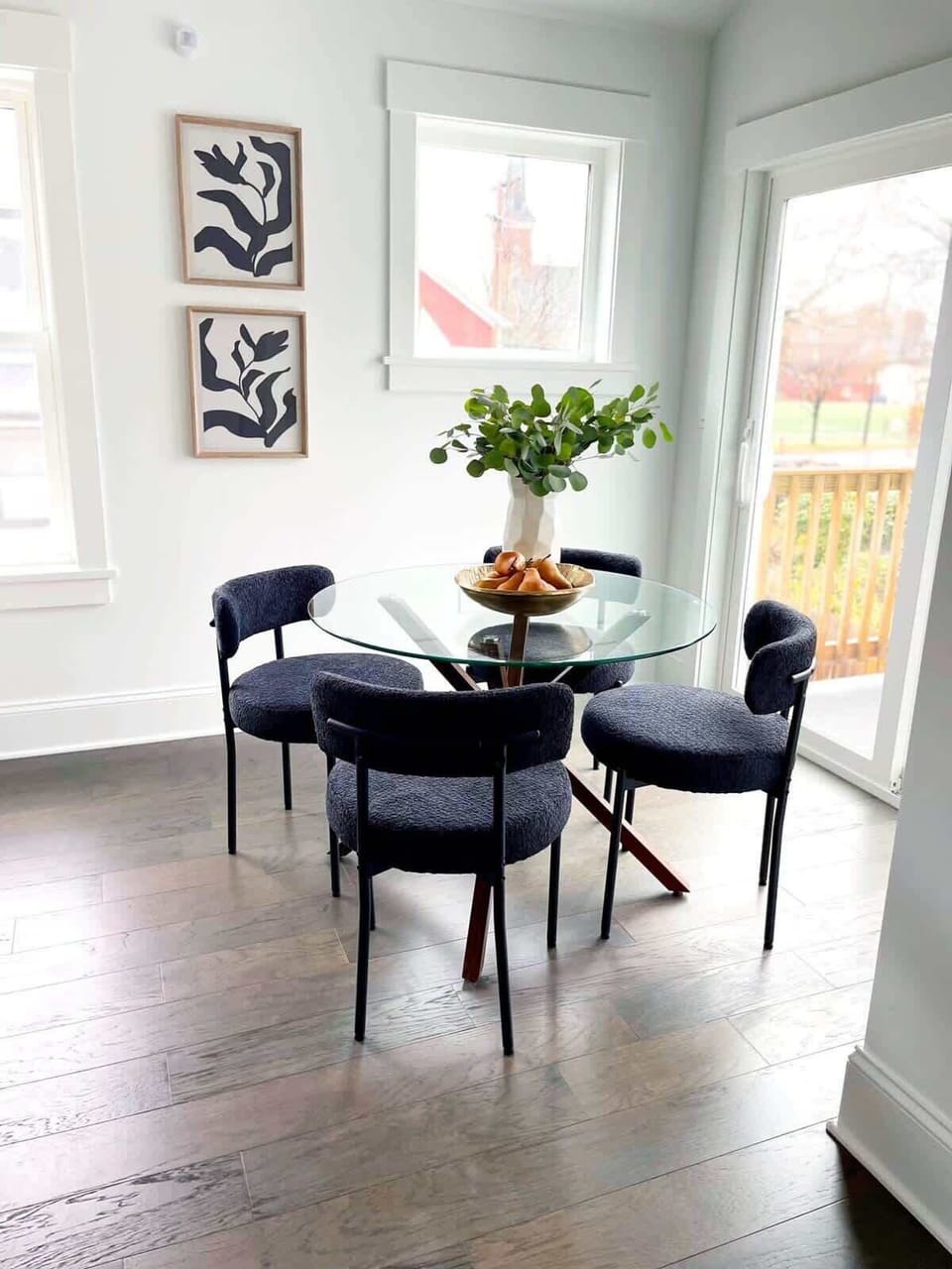 A cozy corner setup featuring a small table and seating area, perfect for casual conversations, coffee moments, or quiet relaxation.