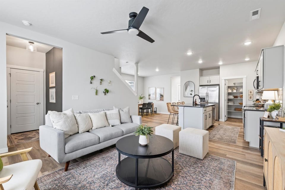 Relax in our inviting living room, seamlessly blending with the open kitchen. Ideal for gatherings, enjoy the cozy ambiance and shared moments in this comfortable space. Your perfect home away from home. 