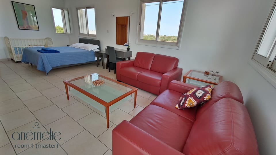 Family room 1 - queen bed, baby cot, balcony, seating area, smart TV, en-suite