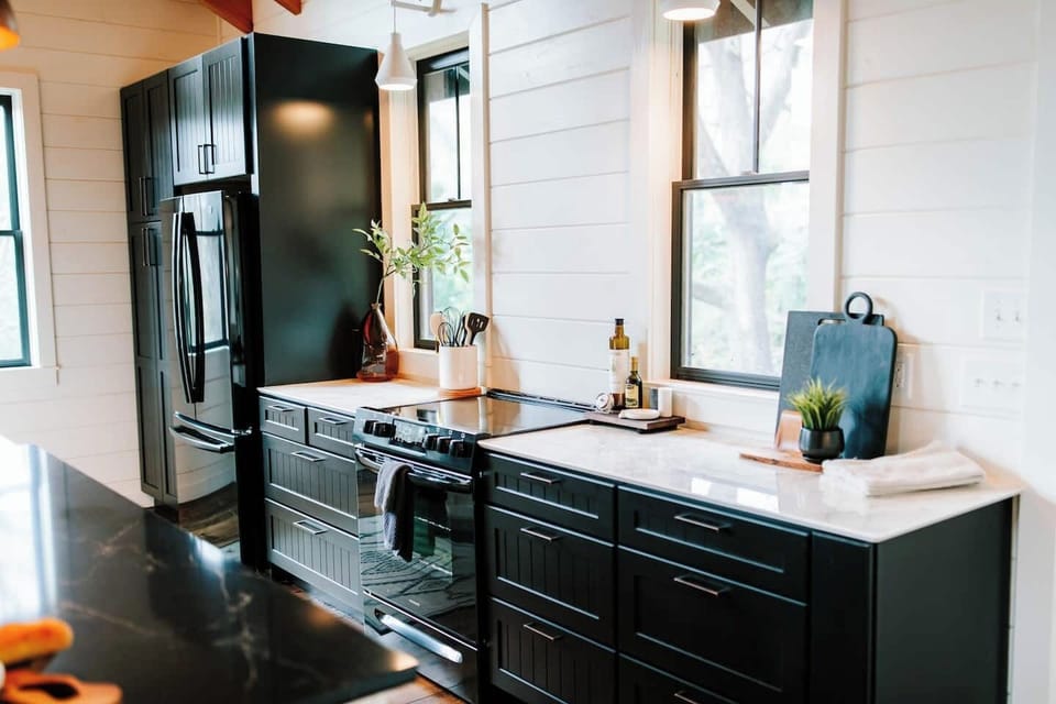 You'll be tickled to cook in the large kitchen with beautiful views.  Outfitted with all the appliances and utensils you will need. (Microwave, crock pot, kettle, Nutri-bullet, toaster, etc). A large panty provide amply space to tuck away groceries.