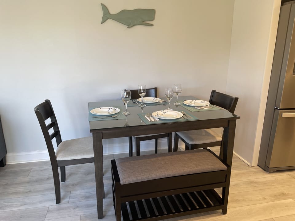 Dining table set for a relaxing evening meal.  Seats 6 people.