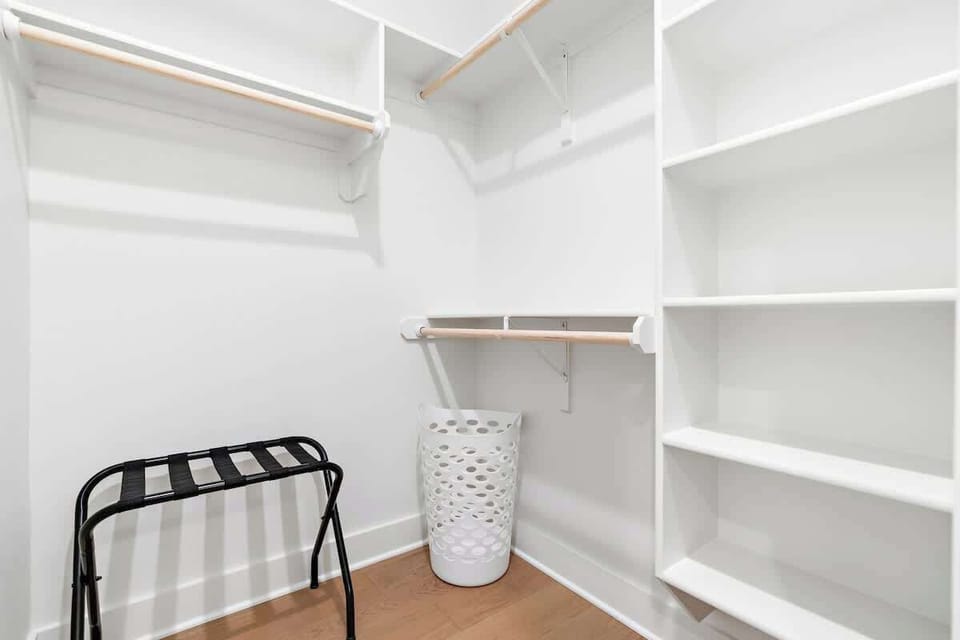 This walk-in closet is attached to the final bedroom's private bathroom.