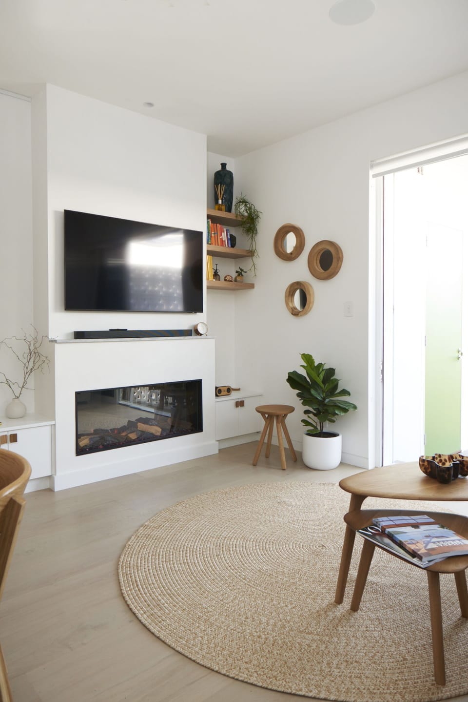Lounge room with cosy fireplace 55" Samsung Smart TV. Bluetooth speaker