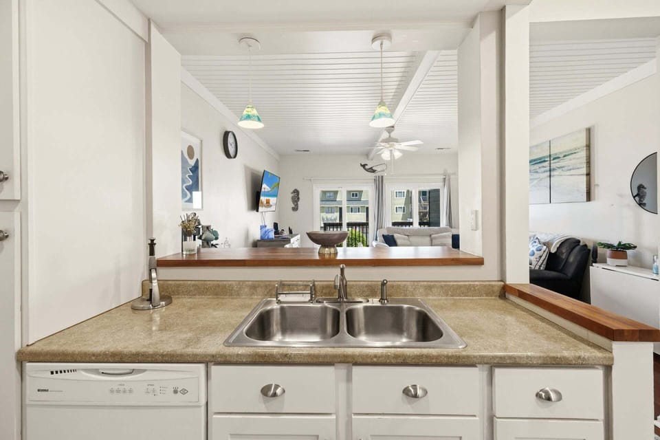 Double sinks in the Kitchen near the Living Area keep the family connected.