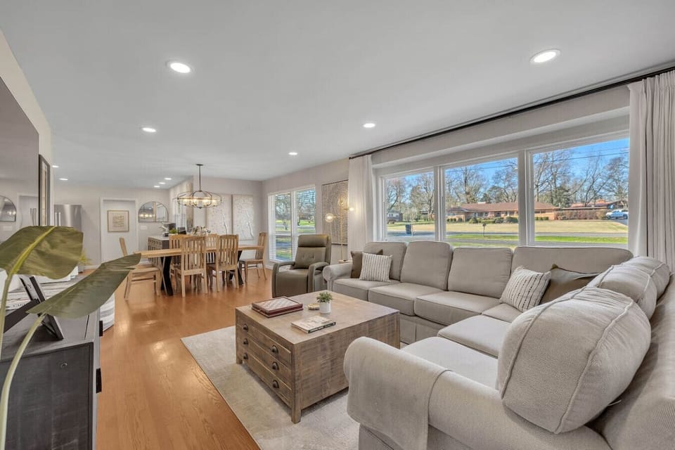 Spacious living room with 60 inch flat screen TV and a extra large sectional sofa