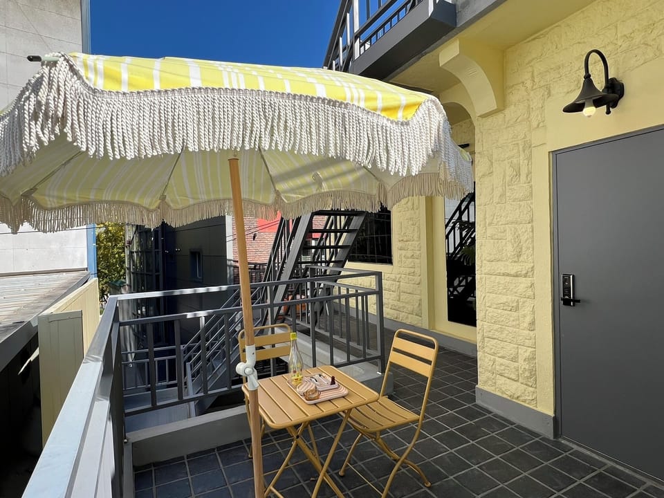 Private yellow terrace for morning coffee or evening wine
