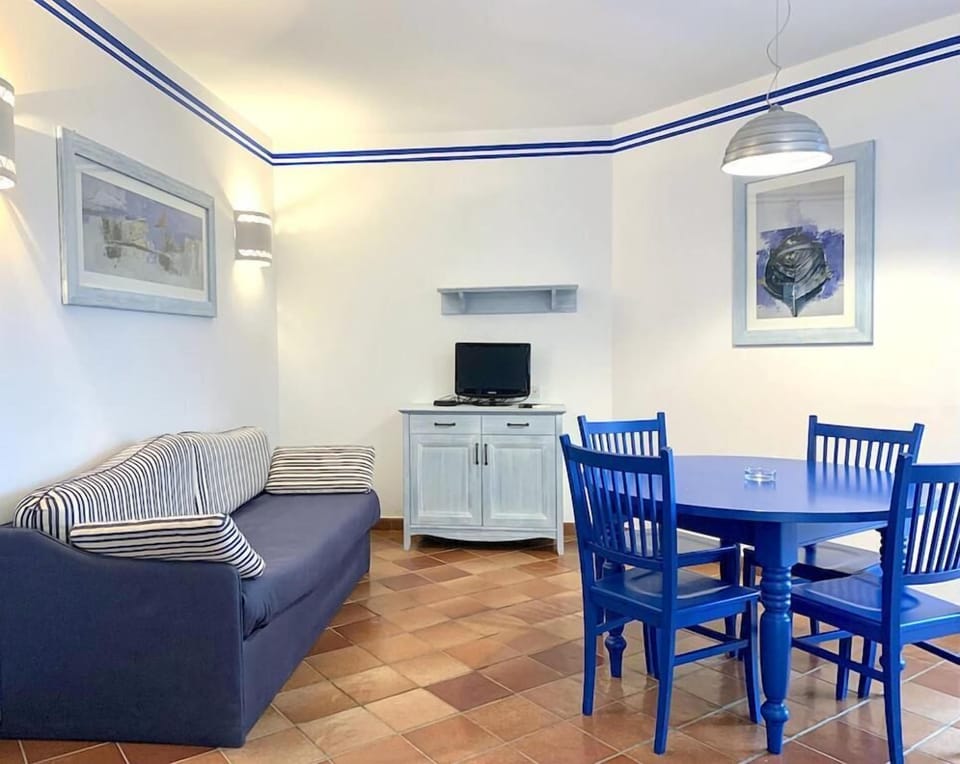 Family Apartment, Pool View | Living area | 32-inch LCD TV with digital channels
