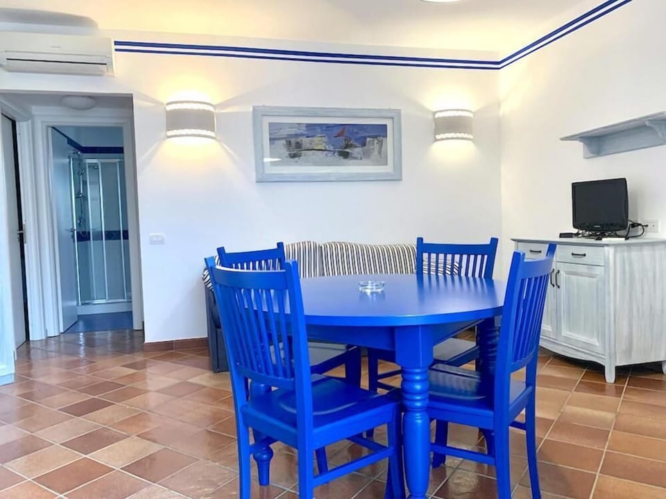 Family Apartment, Pool View | Living area | 32-inch LCD TV with digital channels