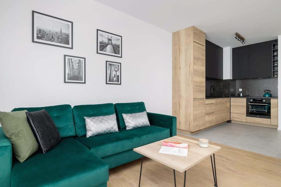 The living room's modern and stylish decor creates a welcoming atmosphere. 