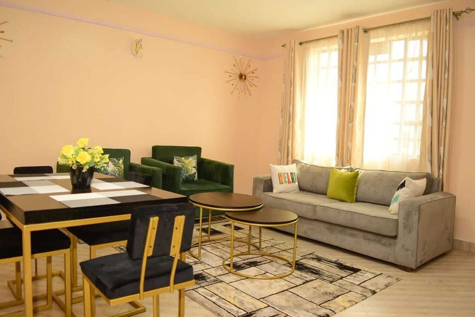 Business Apartment | Living area | 24-inch Smart TV with satellite channels
