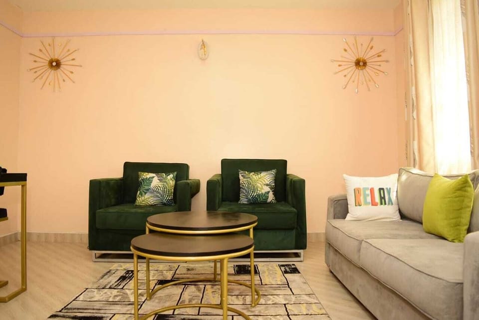 Business Apartment | Living area | 24-inch Smart TV with satellite channels