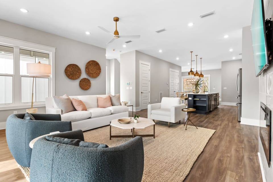 Open-concept living with stylish finishes, modern fireplace, and seamless flow into the kitchen and dining area.