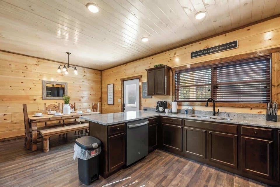 Fully equipped kitchen with a full-size refrigerator, electric cooktop & oven, dishwasher, slow cooker, blender, toaster, Keurig coffee maker, pots, pans, plates, bowls, cups, knife block, kitchen utensils, BBQ utensils to cook your favorite meals!