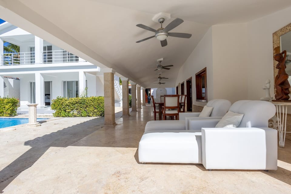 Delight in the outdoor spaces, including loungers, dining area and private pool