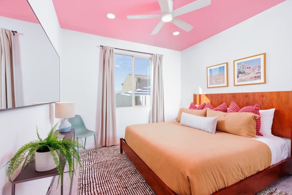 Charming Bedroom with Vibrant Decor and Comfortable King Bed – A Perfect Blend of Style and Comfort for a Restful Stay!