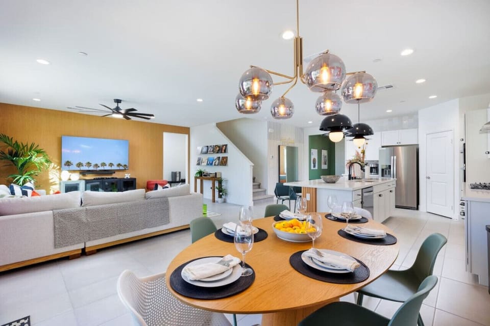 Spacious Open-Concept Living and Dining Area with Modern Lighting and Elegant Decor – Perfect for Family Gatherings and Entertaining!