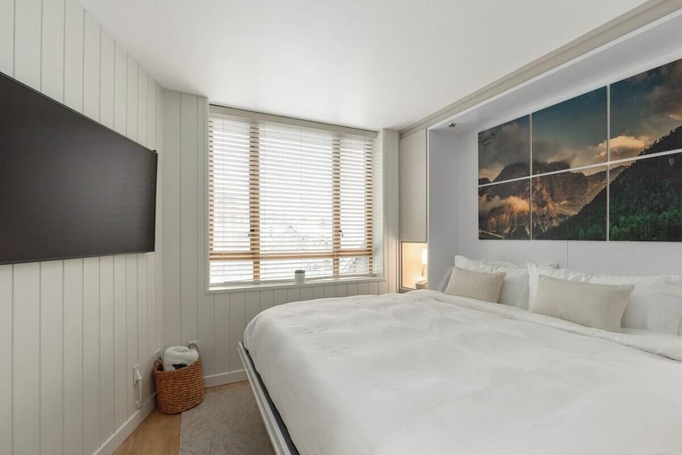 The King Murphy Bed pulls down from the wall and over the couch and coffee table. Just remove the back couch cushions and put them to the side.
