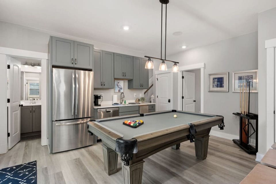 Modern kitchen w/ stainless appliances, center island & space to cook together.