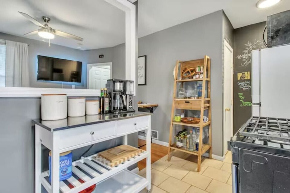 The fully equipped kitchen has everything you need to whip up a delicious meal, including a stove, oven, microwave, and refrigerator. A dining area is also available for enjoying your home-cooked creations.