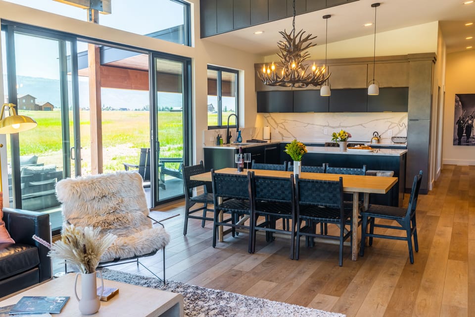 Dining table seats 8, plus 3 more at the island counter.
