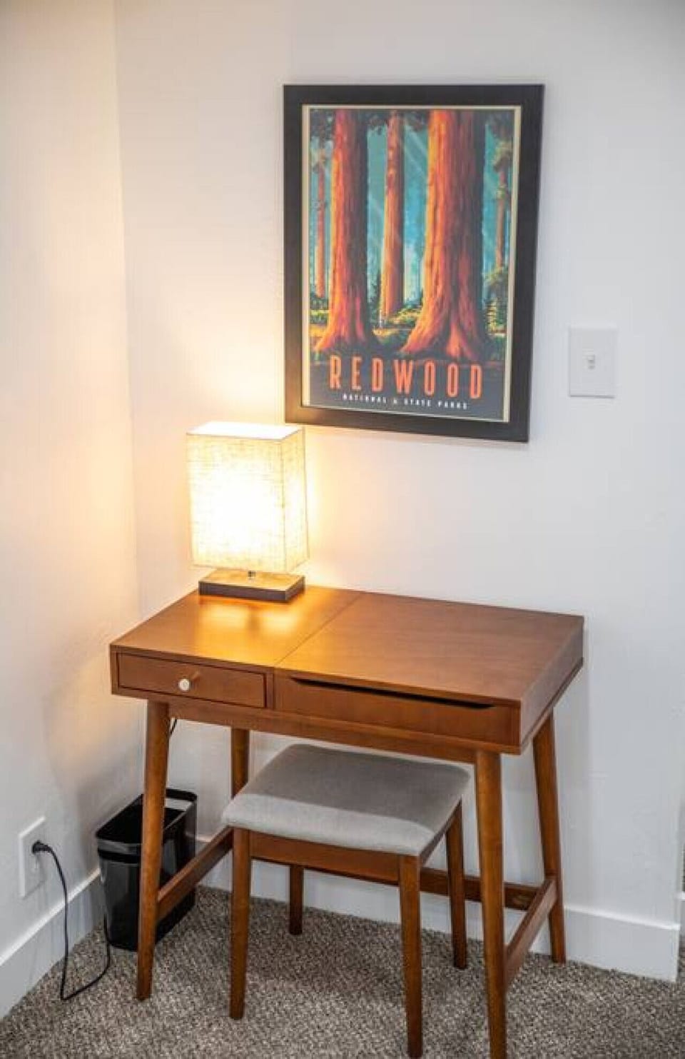 Elevate your space with a sleek table and stool, accompanied by a stylish table lamp. Adorn the walls with captivating wall art, adding artistic charm. Experience the perfect fusion of functionality and aesthetics in this well-designed corner.