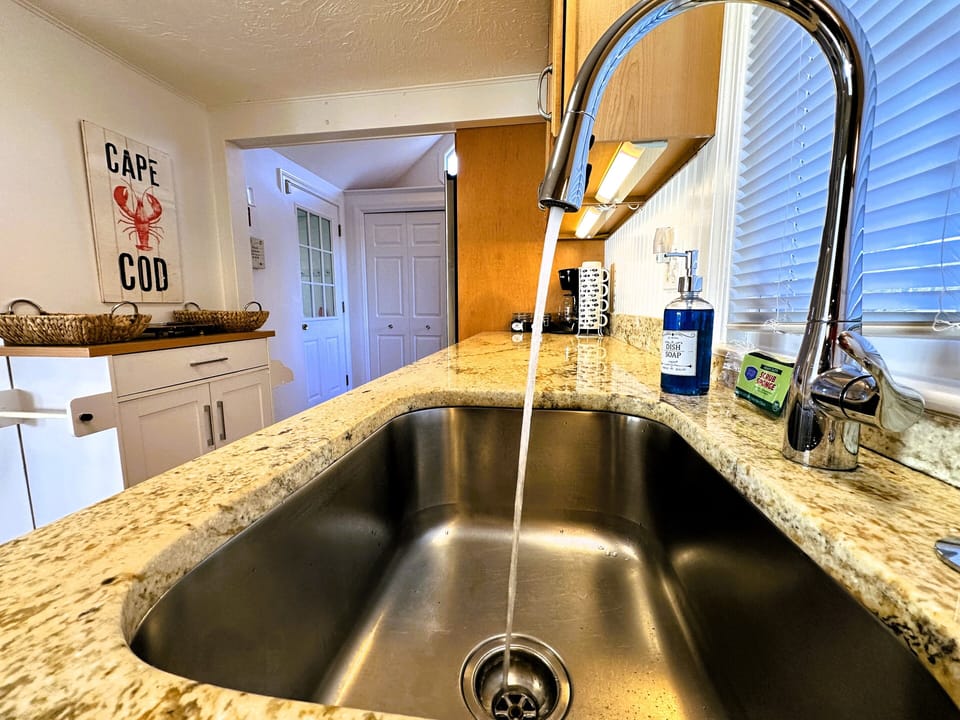 Large kitchen with stainless steel appliances and granite countertops