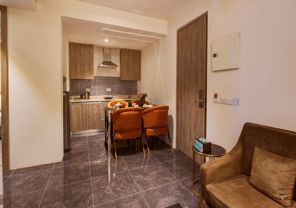 Executive Two Bedroom Suite with Living room, with Complimentary Hi-Tea & 1 Pint of Beer | Living area | 32-inch flat-screen TV with cable channels