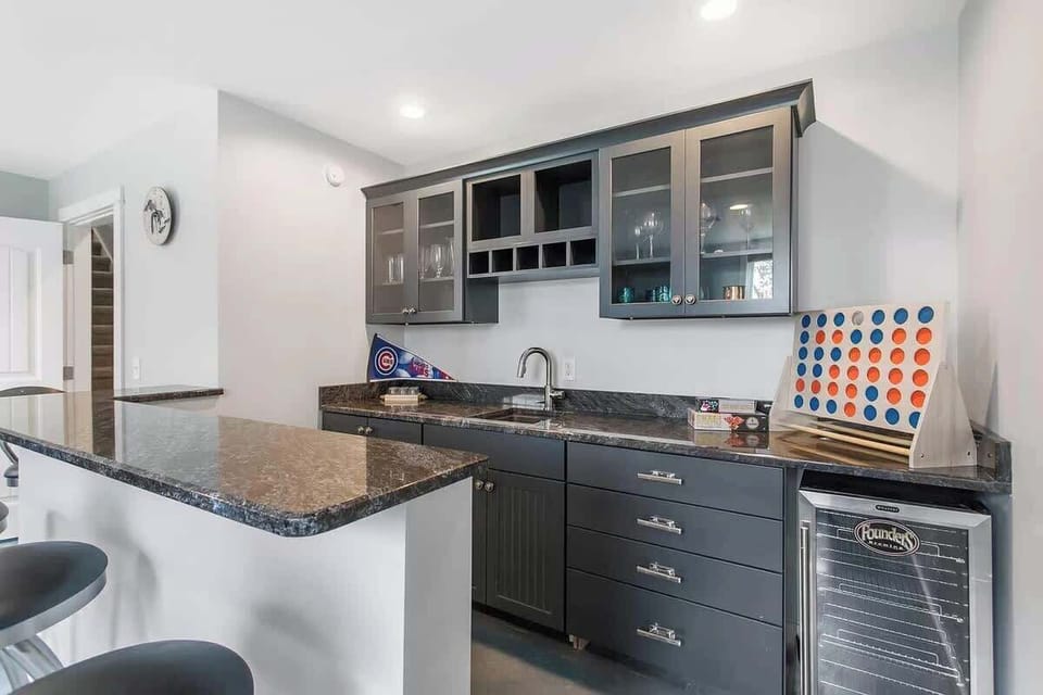 The Game Room Comes Equipped with a Wet Bar, Ideal for Enjoying an Evening Cocktail or Two
