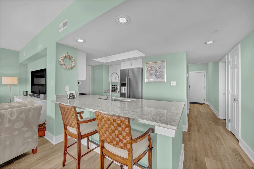Gather around your open-concept kitchen island with granite countertops and modern appliances - perfect for morning coffee or evening conversations.