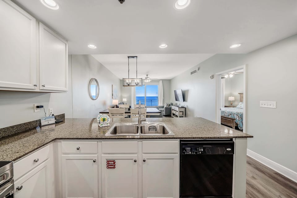 The fully equipped kitchen features granite countertops and stainless-steel appliances and has everything you need to cook meals for family and friends.