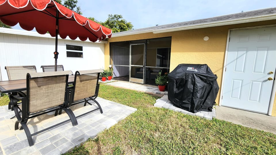 BBQ Grill with Patio table and chairs for outdoor dining with firepit