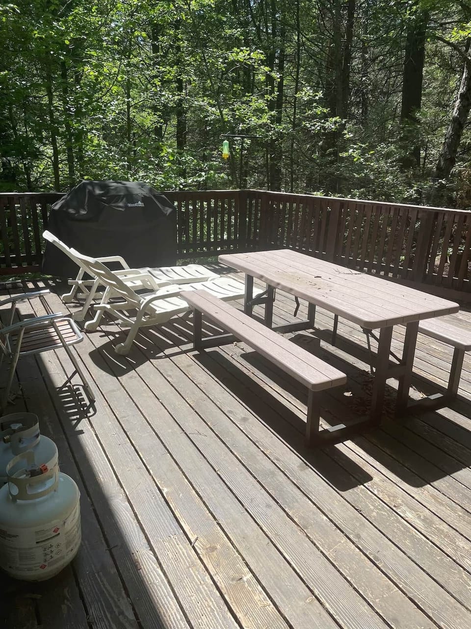 Deck picnic table. Dining in the trees over the creek.