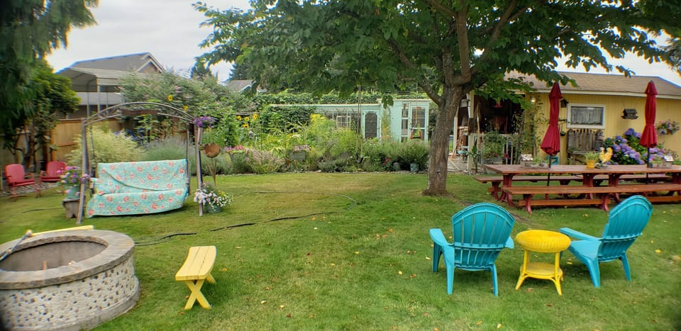 Looking across yard from other side of covered patio.