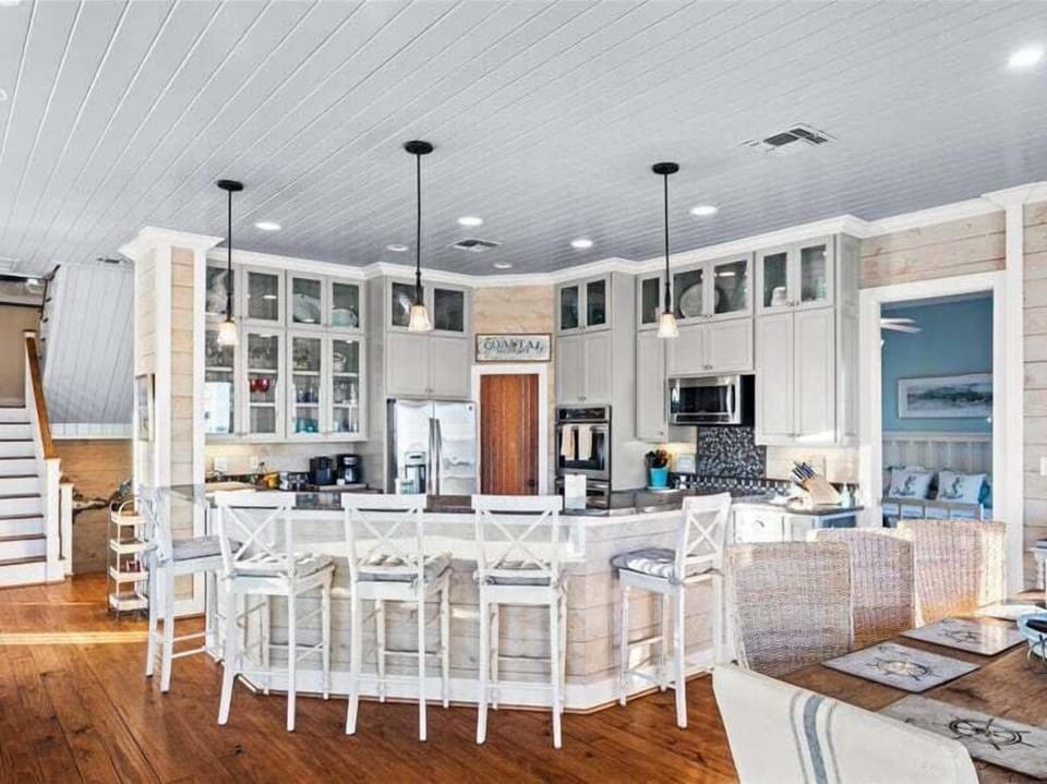 Fully equipped kitchen with large island, bar seating, and modern appliances—perfect for entertaining groups.