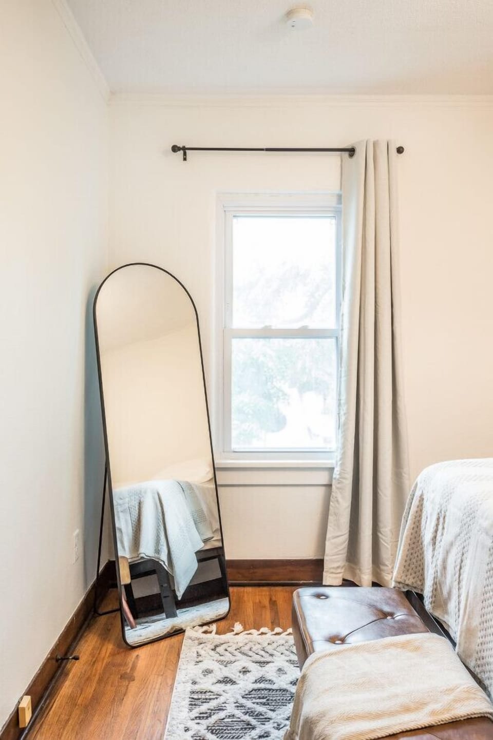 Let natural light fill the room through our bedroom window.