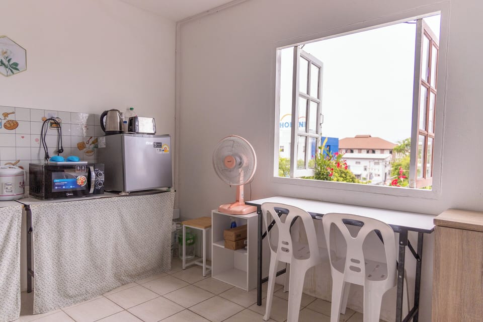 Mini-fridge, microwave, electric kettle, dining tables