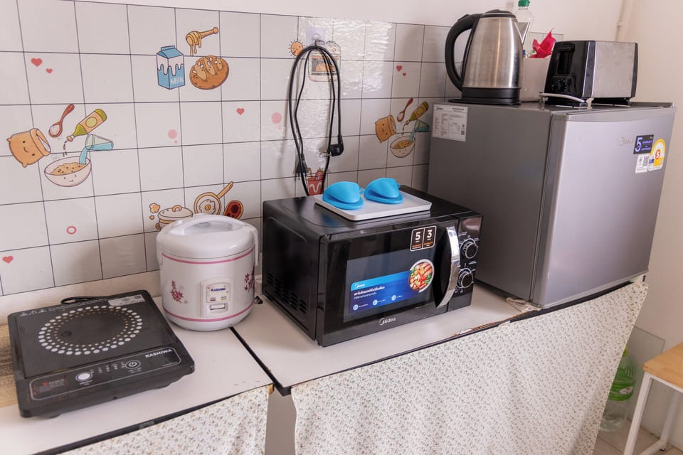 Mini-fridge, microwave, electric kettle, dining tables