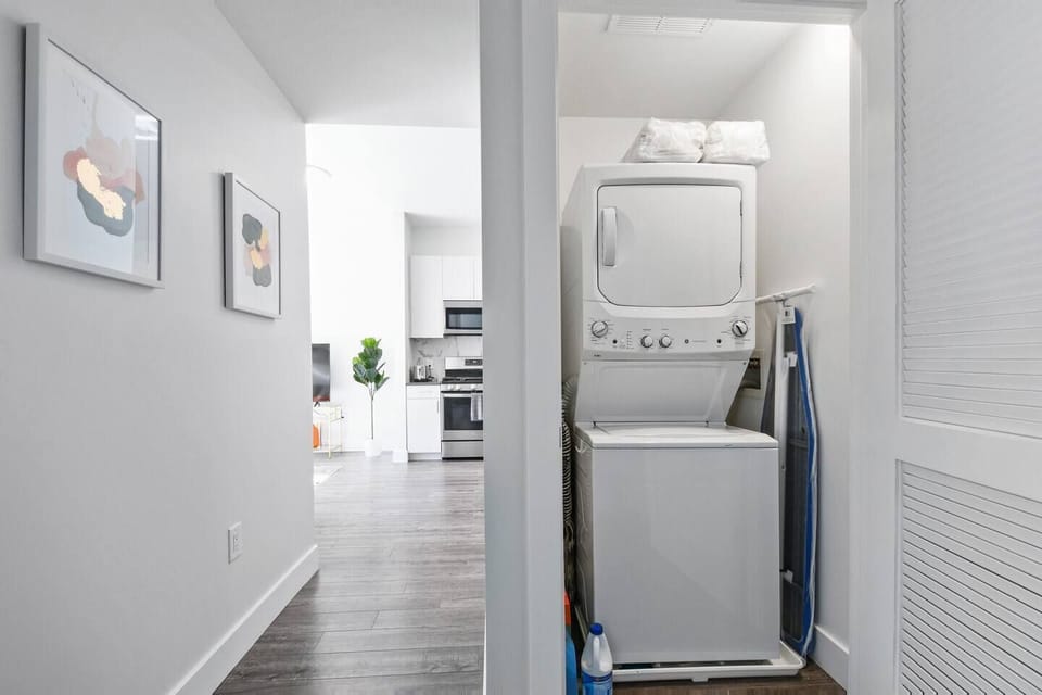 full washer and dryer in unit with bleach,softener, detergent, and dryer sheets 