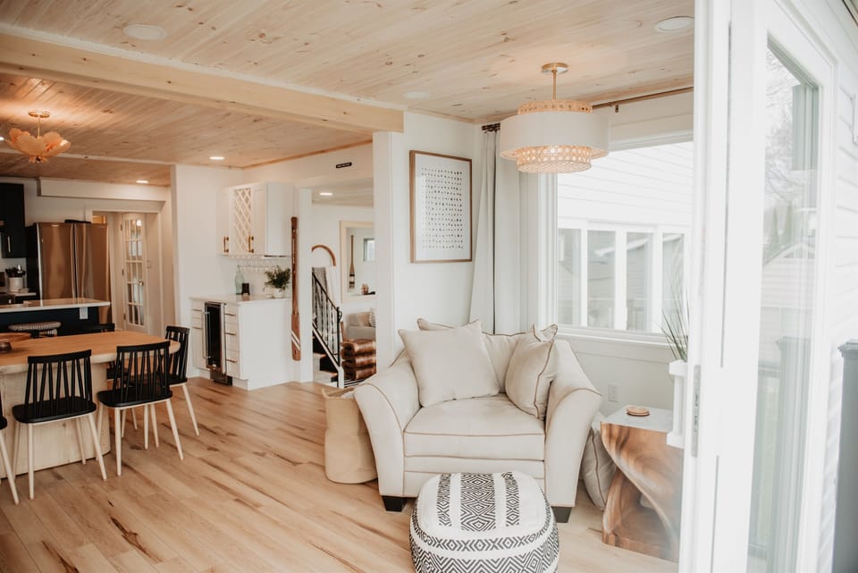 One of two cozy seating nooks near the sliding doors—perfect for morning coffee, reading, or soaking in the lake views.
