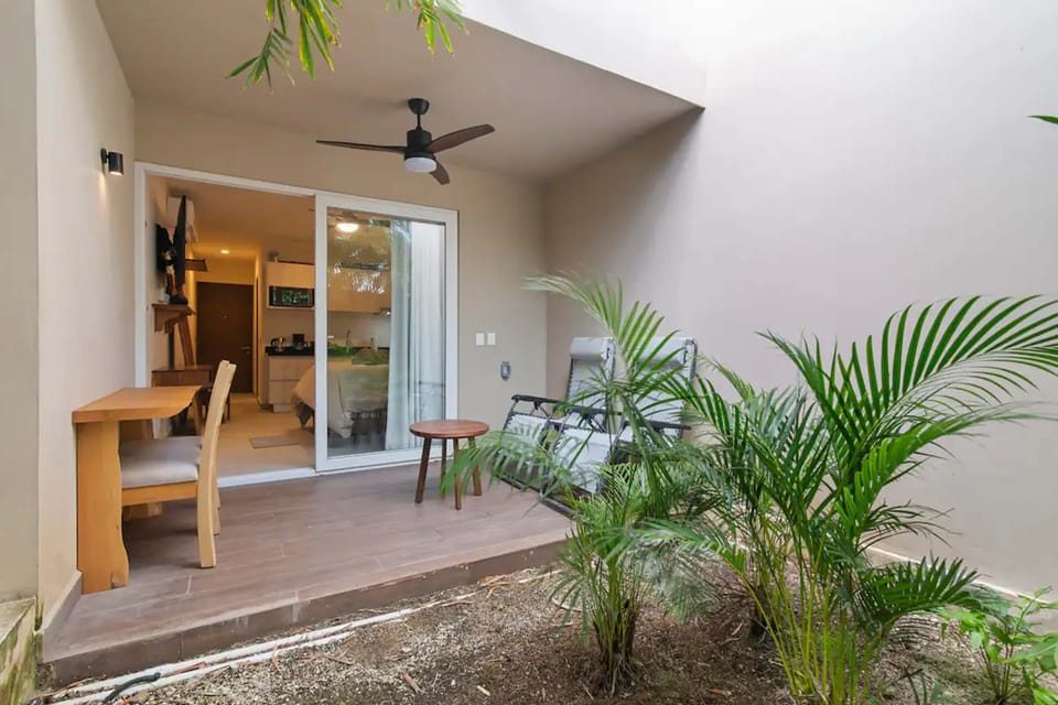 Charming patio: Ceiling fan, al fresco dining. Comfort meets ambiance.