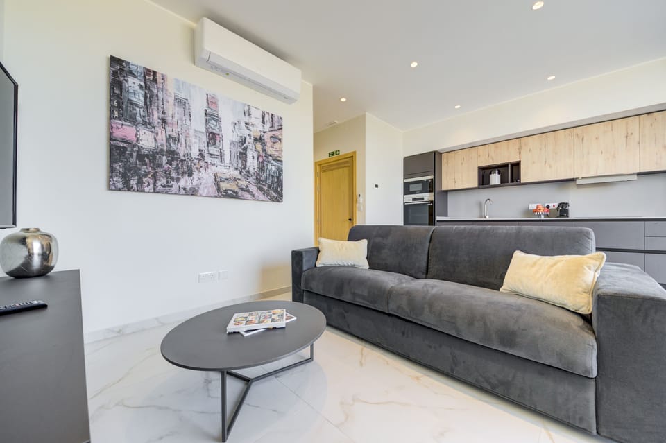 Sink into our comfortable sofa and relax in our inviting living room
